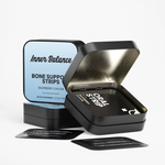 Open tin of Inner Balance Bone Support Strips showing individual fast-dissolving strips